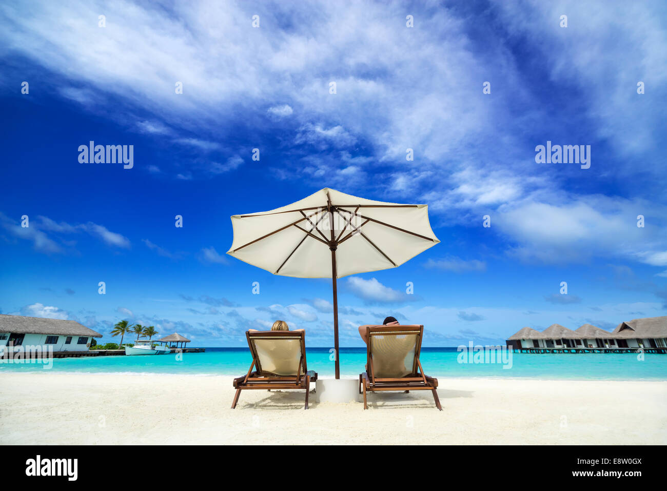 Couple on a tropical beach at Maldives Stock Photo