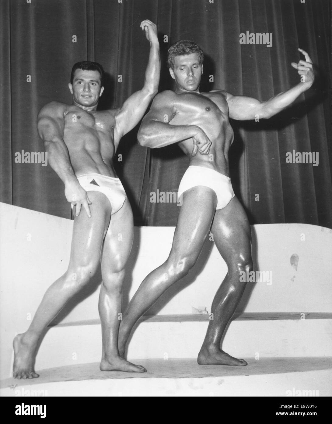 Paris, France. 26th Apr, 1959. Bodybuilding Winners L-R ANDRE HAVIO, in Short category, and CHRISTIAN BARRAU, in Tall category, win Mr Paris 1959 (Short) and Mr Paris 1959 (Tall), pose for their judges at the Maison de la Chimie, Paris. © KEYSTONE Pictures/ZUMA Wire/ZUMAPRESS.com/Alamy Live News Stock Photo