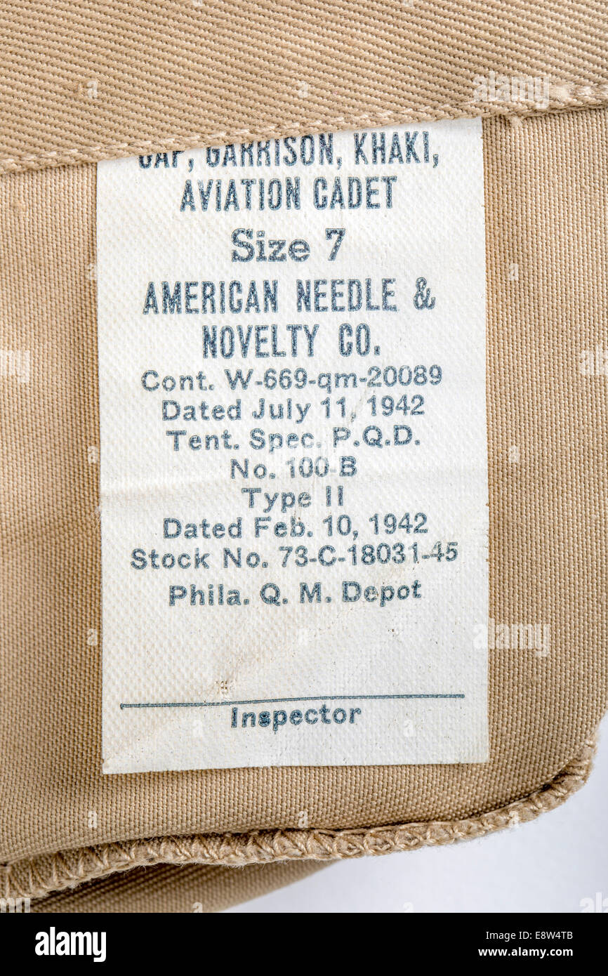 July 11, 1942 inspector's label inside a khaki color garrison hat worn by American soldiers during World War II. Stock Photo