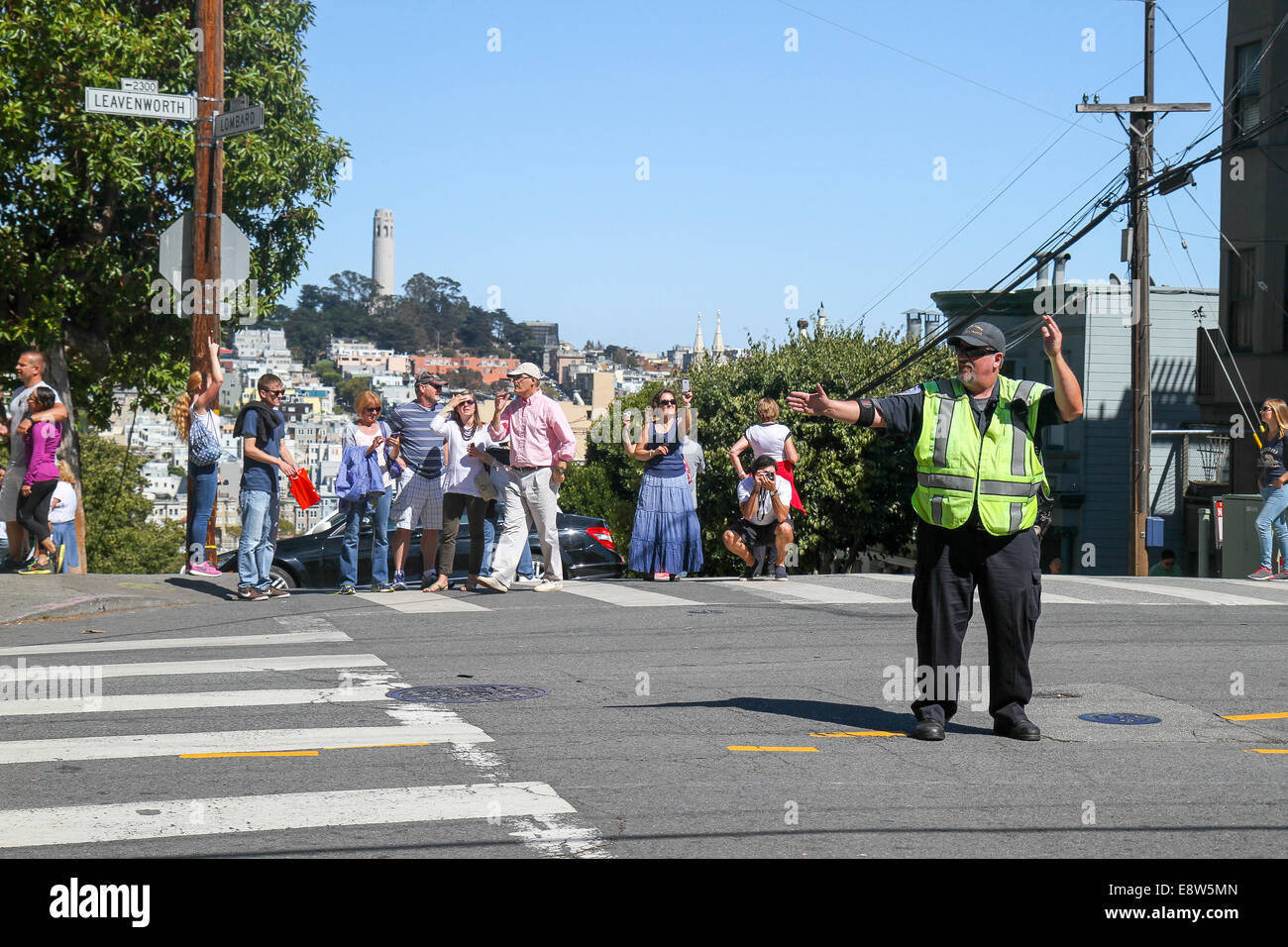 Man on Lombard Street directing traffic, Russian Hill, San Francisco, California, United States, North America Stock Photo