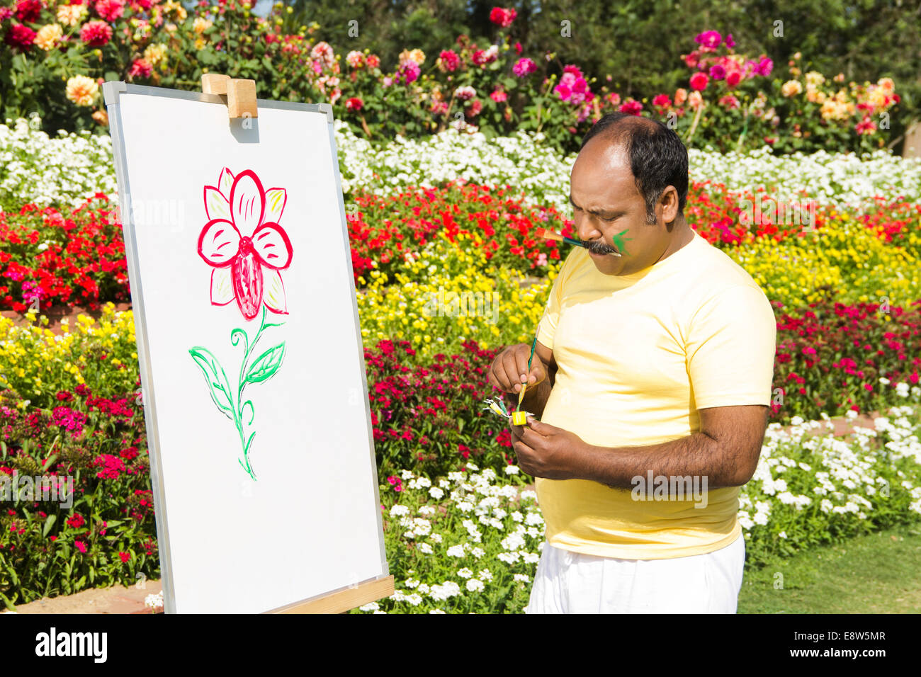 Indian man painting hi-res stock photography and images - Alamy