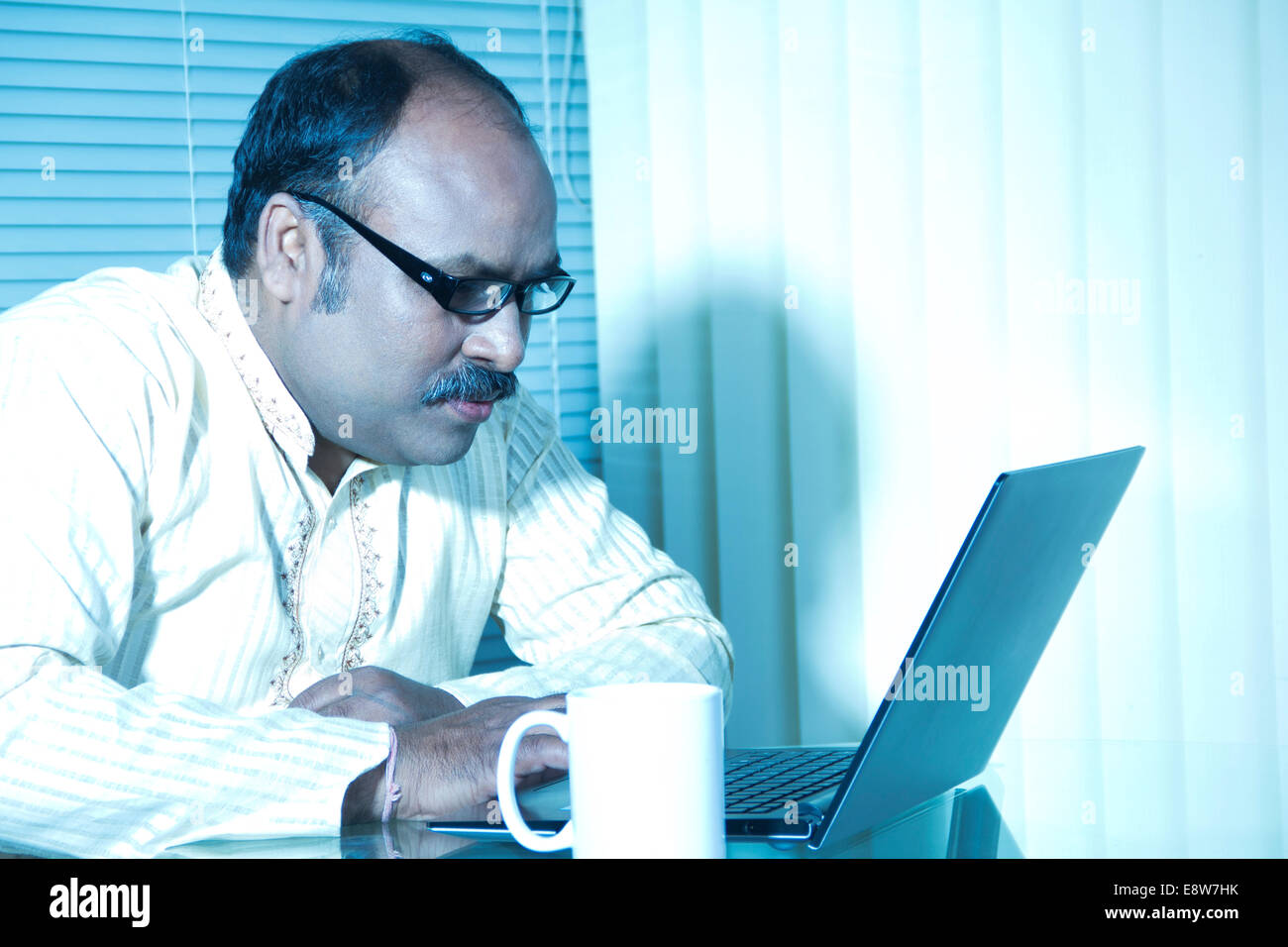 1 Indian man Working in Office Stock Photo