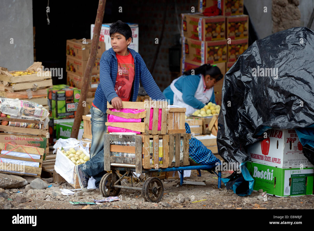 Child labour, boy, 13 years, working as a porter at a market, Ayacucho, Ayacucho region, Peru Stock Photo