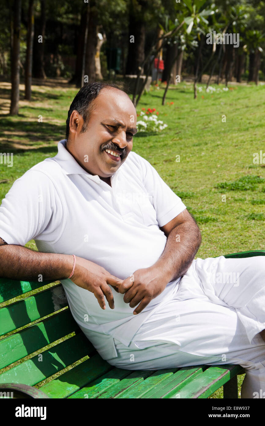 1 Indian Man Sitting in Park Stock Photo - Alamy
