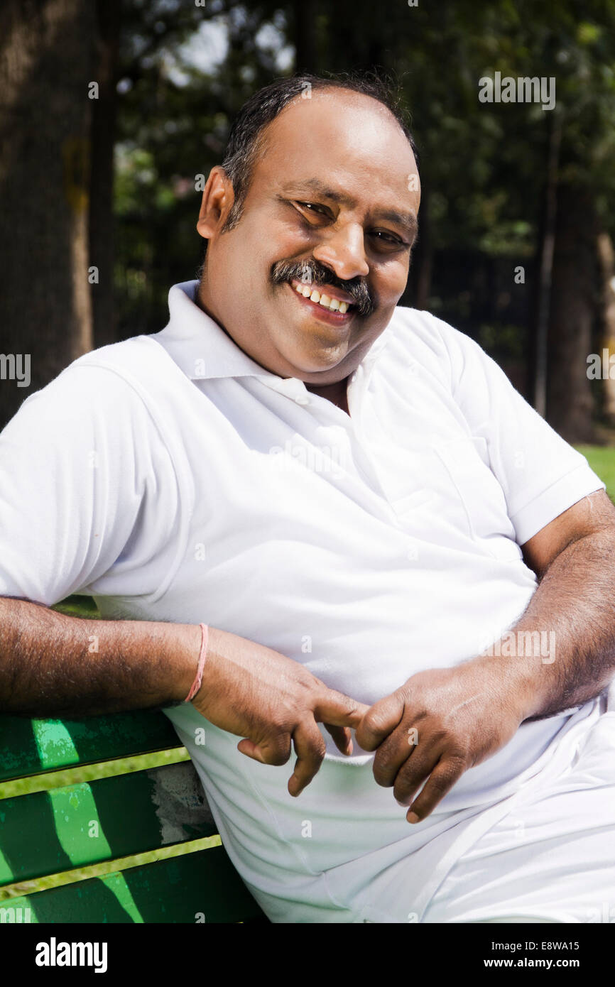 1 Indian Man Sitting in Park Stock Photo - Alamy