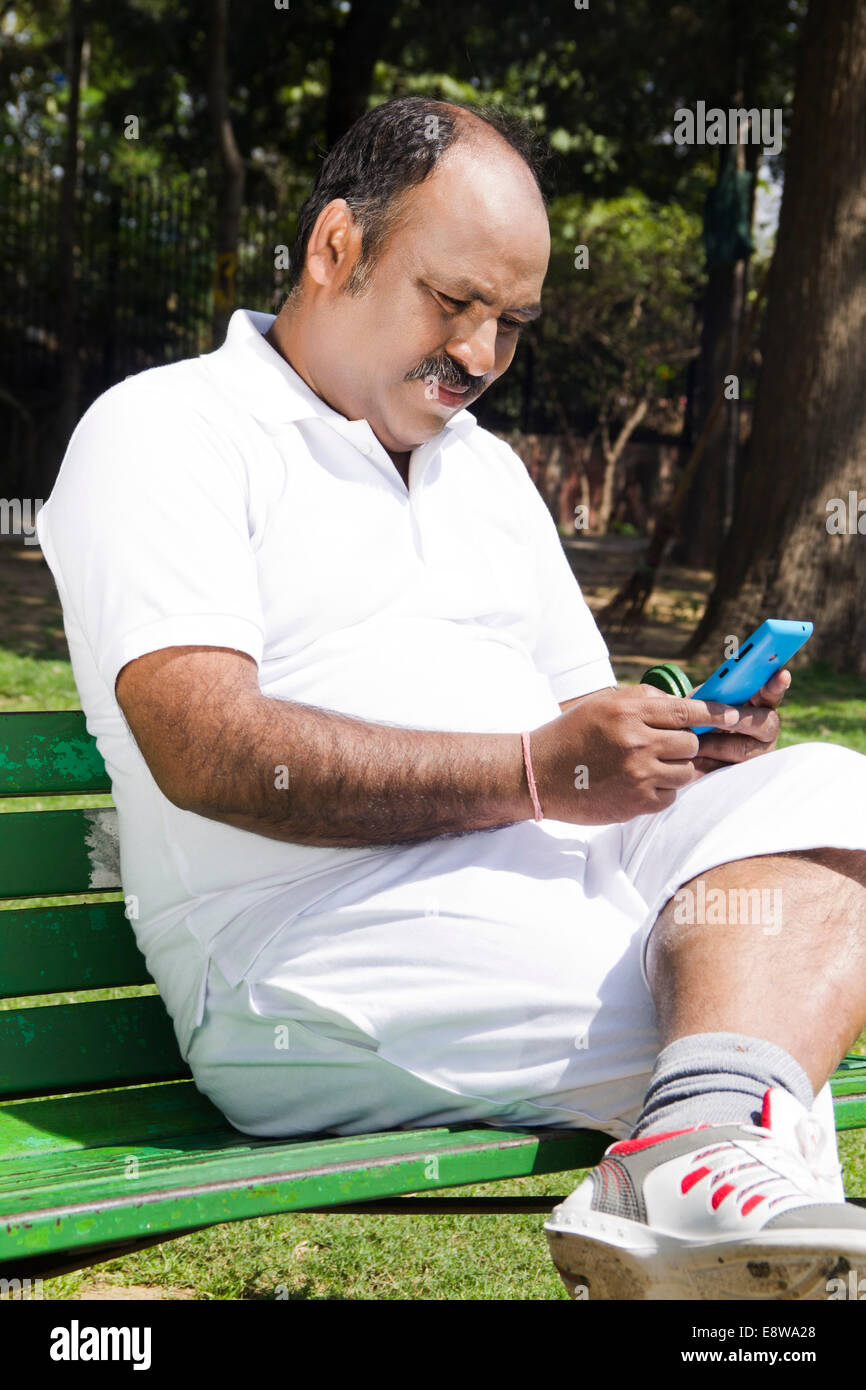 1 Indian Man Sitting in Park Stock Photo - Alamy