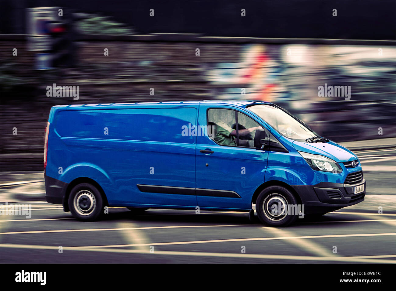2014 Ford Transit Van driving in the city Stock Photo