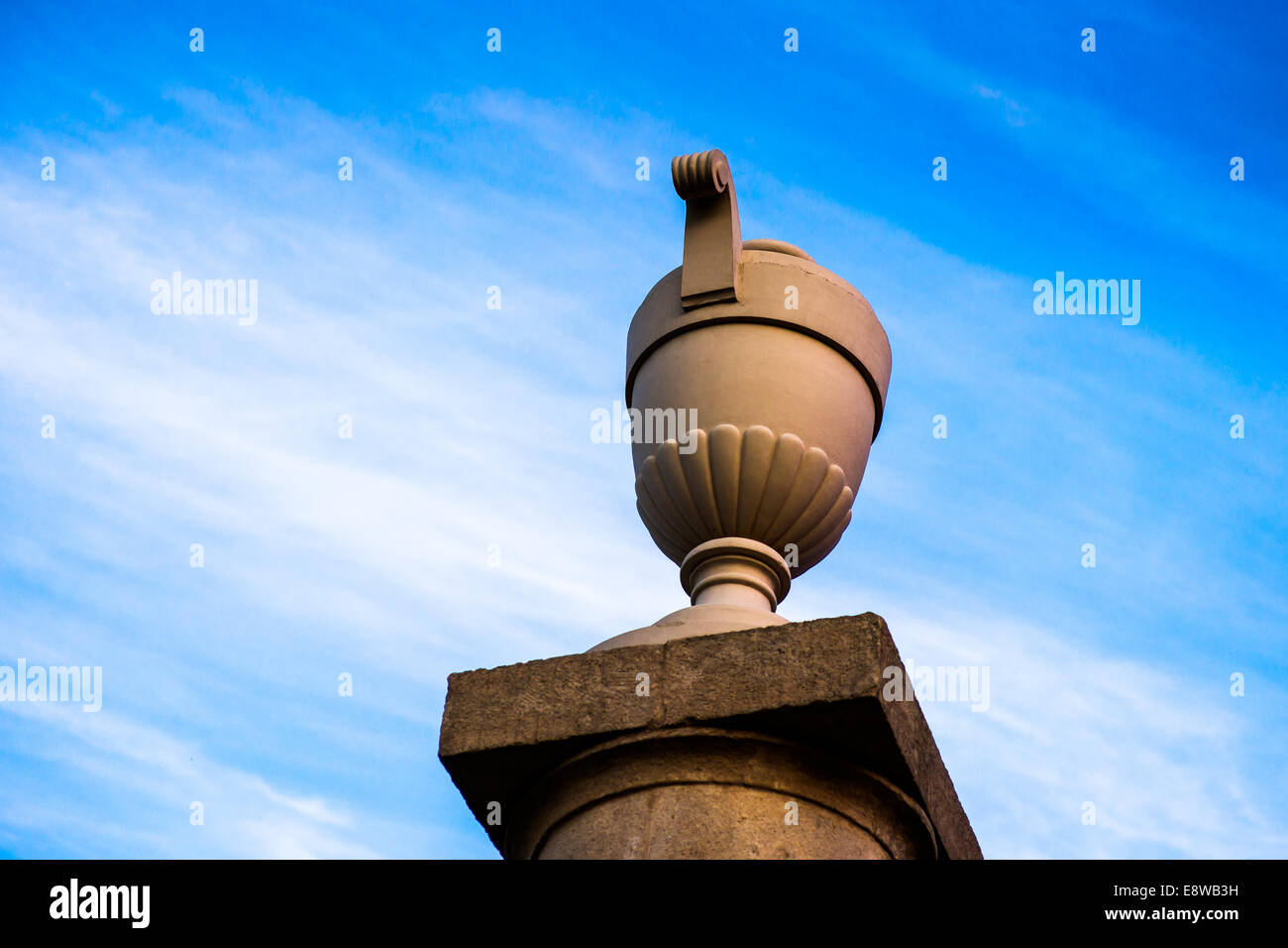 Eternity. A decorative urn against the background of endless sky with cirrus clouds Stock Photo