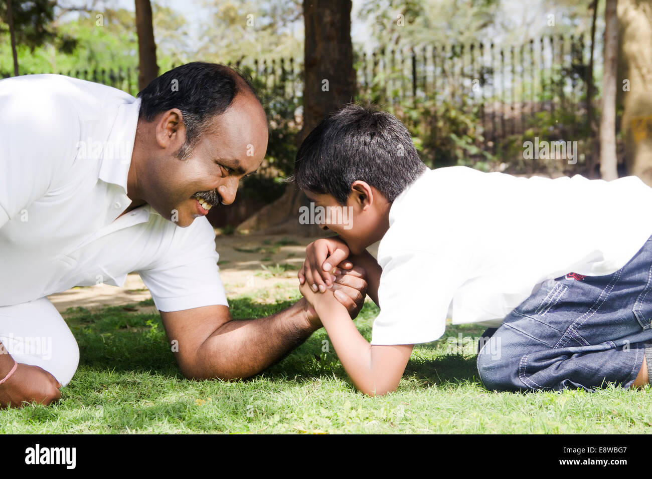 1 Indian man Playful With Kid Stock Photo