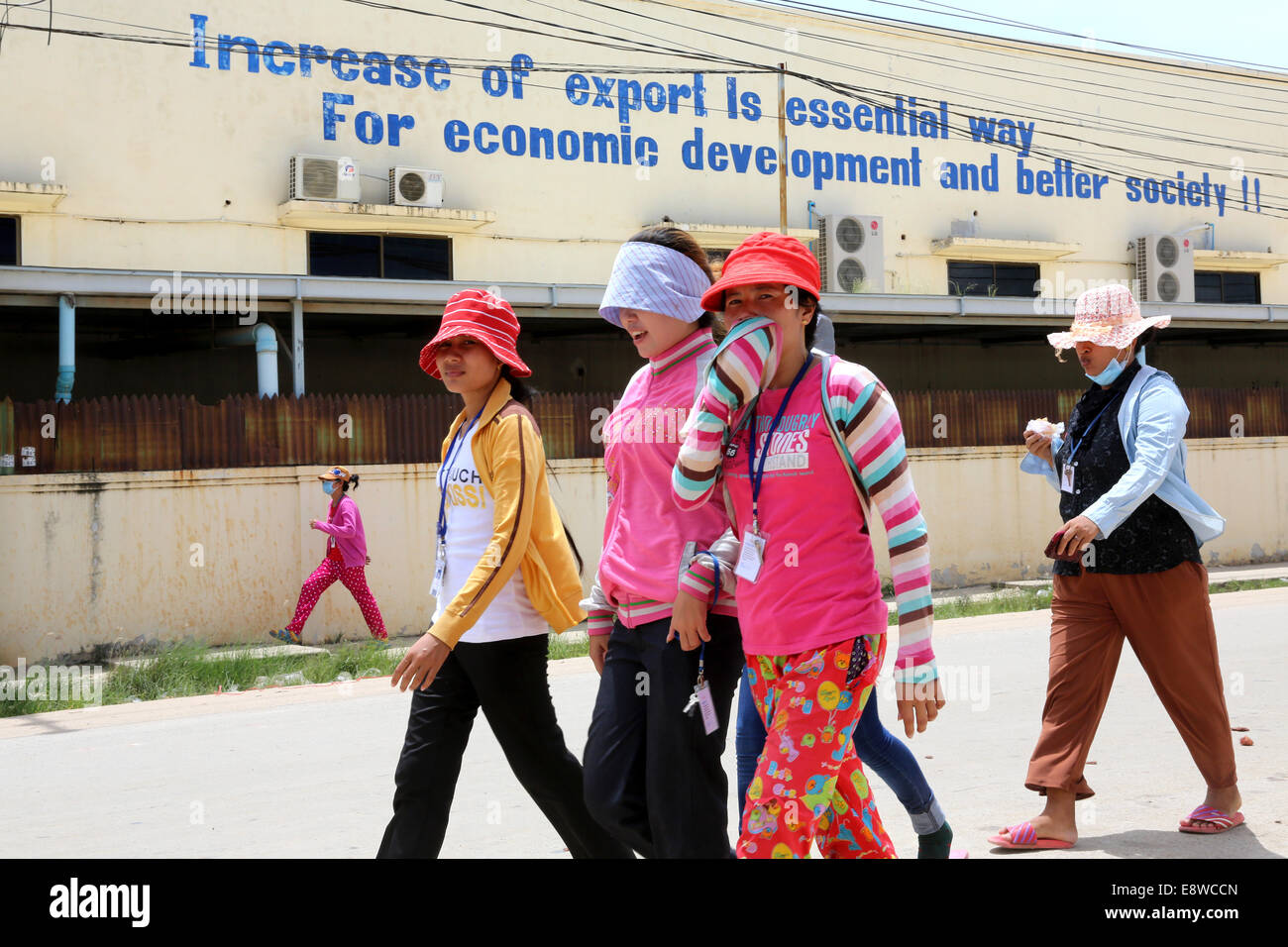 Female textile worker shift change outside a garment factory in the Pochentong industrial area in Phnom Penh, Cambodia. Stock Photo
