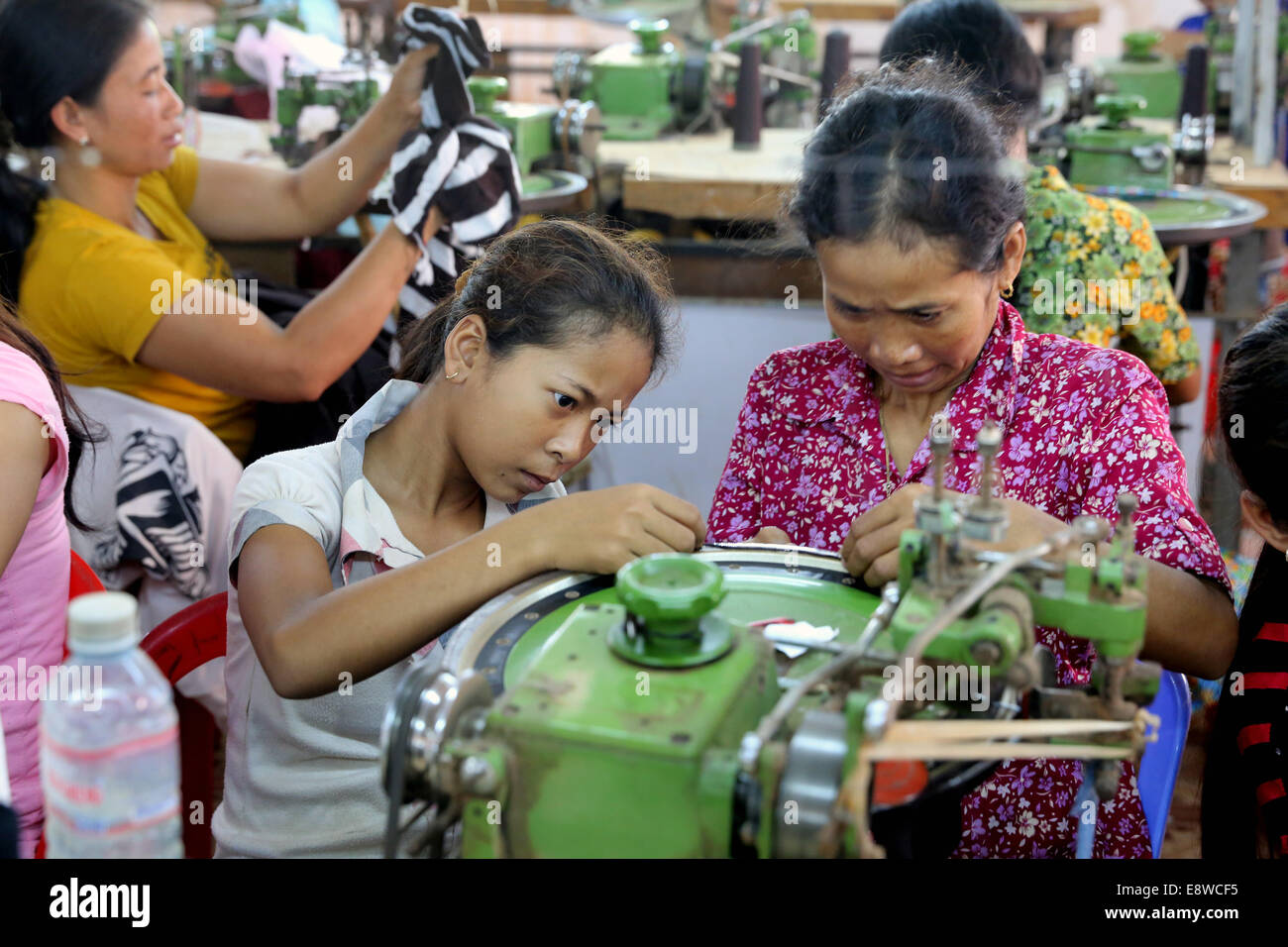 Female workers in a chinese operated textile factory in Thanaut Tee village, Takeo province, Cambodia, Asia Stock Photo