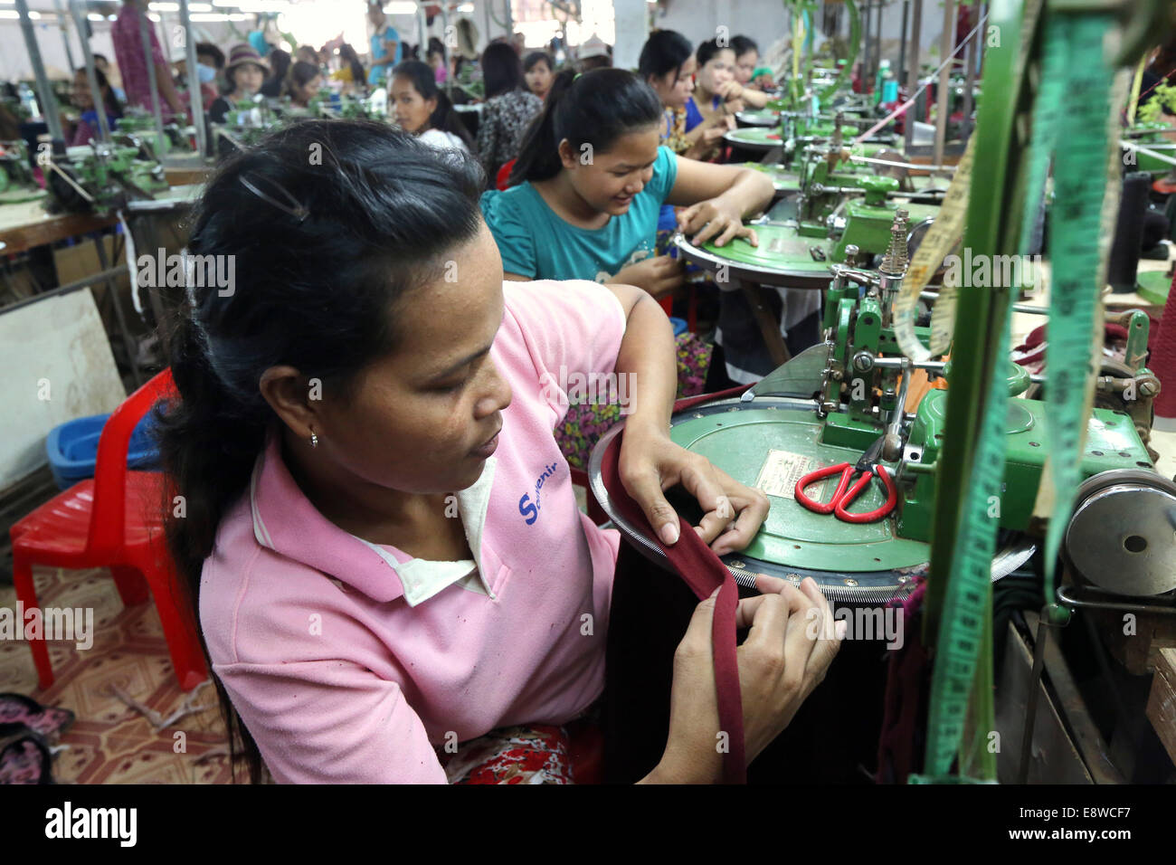 Female workers in a chinese operated textile factory in Thanaut Tee village, Takeo province, Cambodia, Asia Stock Photo