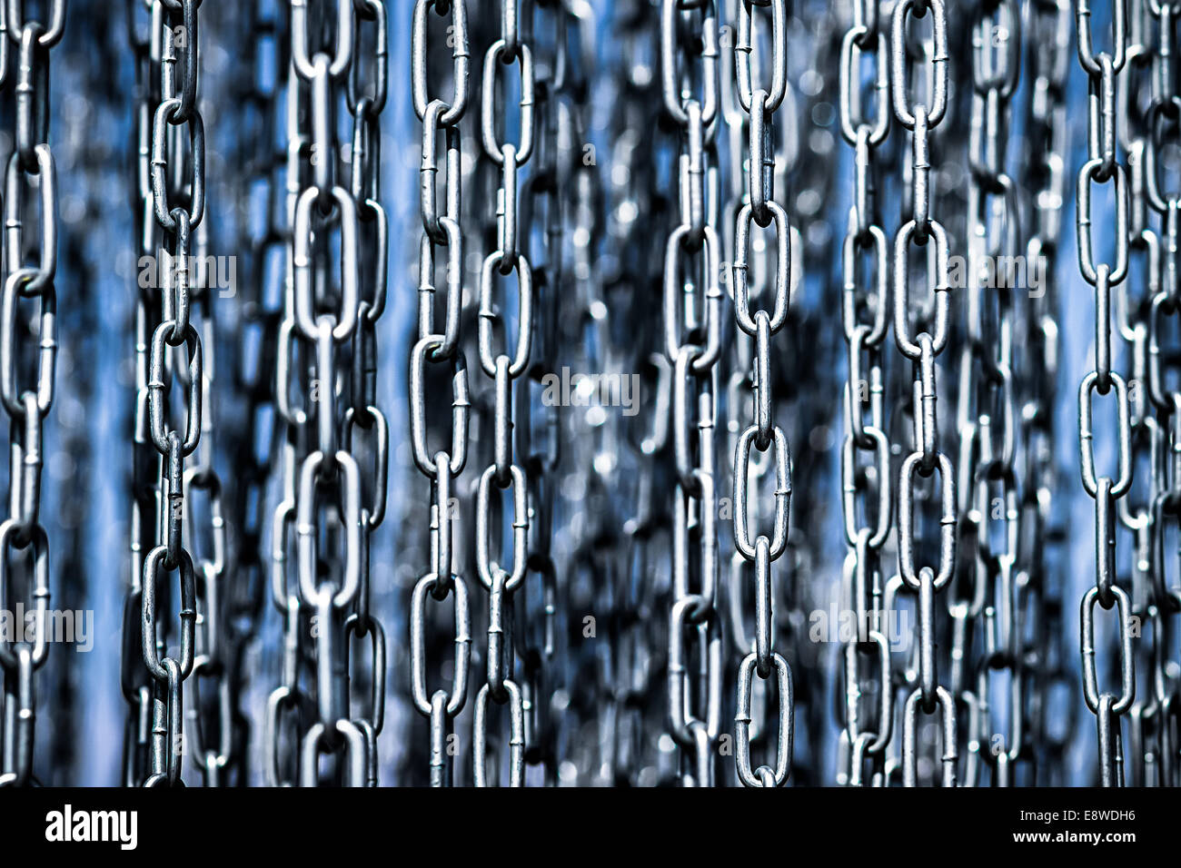 Links. Closeup view of freely hanging metal chains Stock Photo Alamy