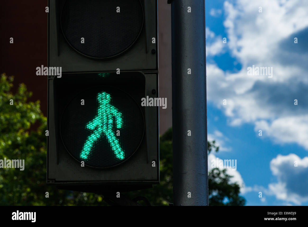 Extraterrestrial. Little green man is coming from the sky down to the Earth Stock Photo