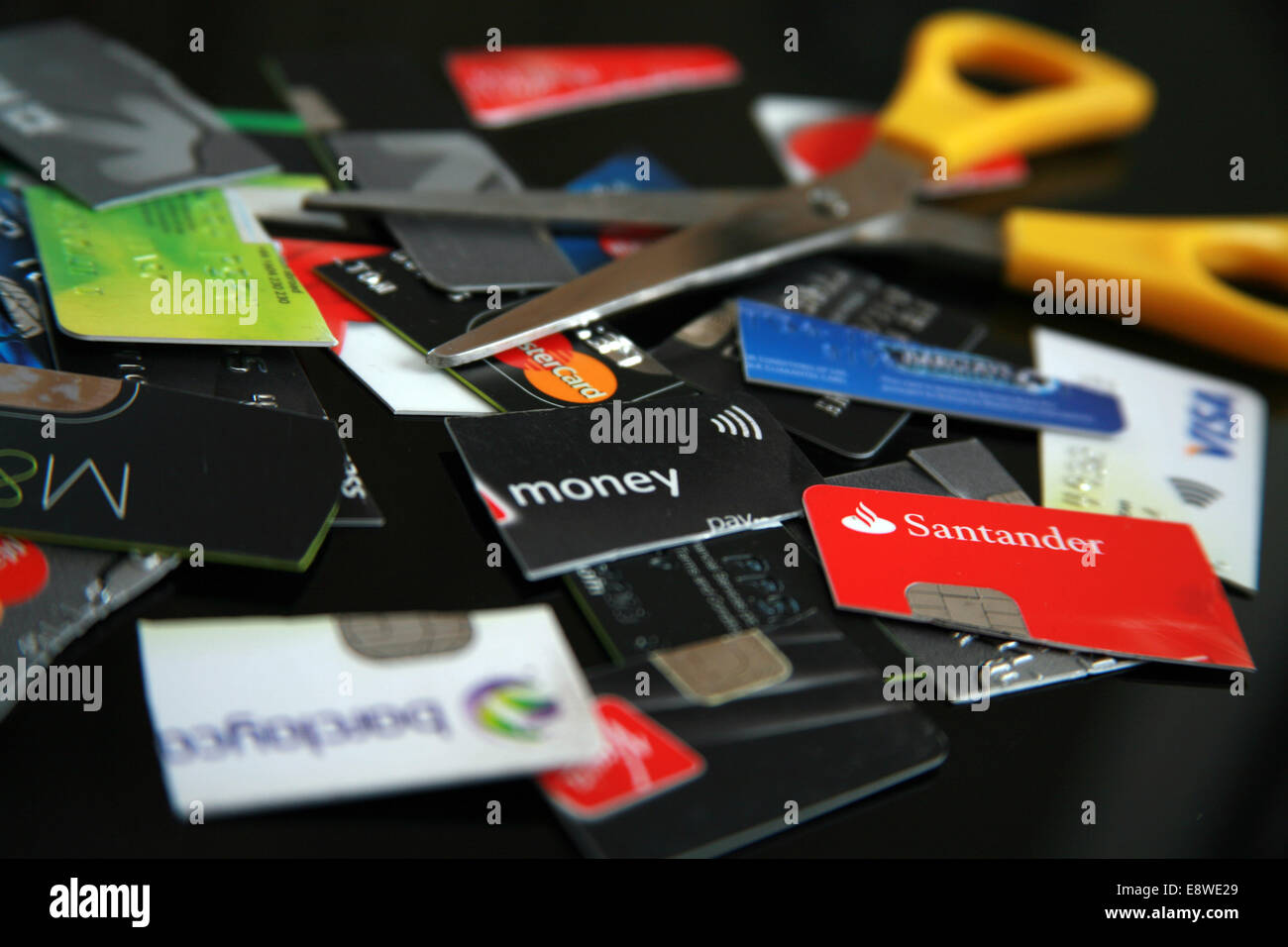 Credit cards cut into pieces Stock Photo Alamy