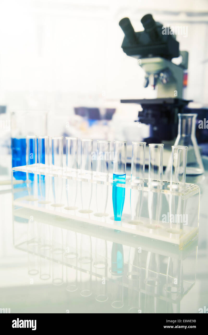 Rack of test tubes with solution in lab Stock Photo