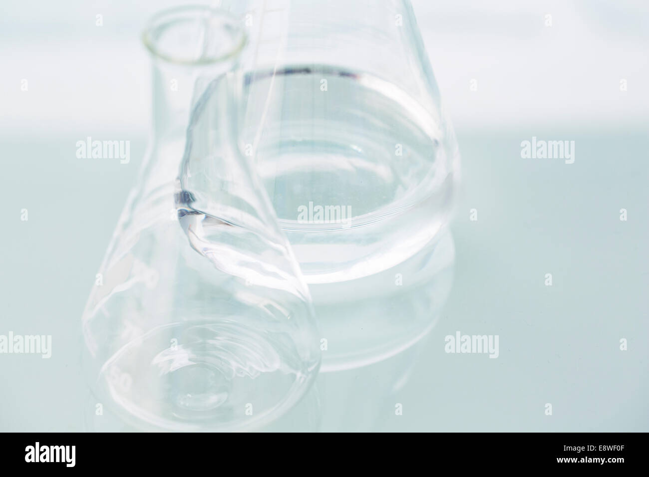 Close up of empty beakers on counter in lab Stock Photo