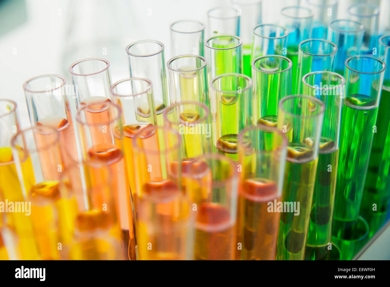 Close up of rack of test tubes with solution in lab Stock Photo