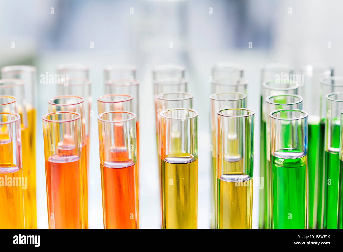 Close up of rack of test tubes with solution in lab Stock Photo