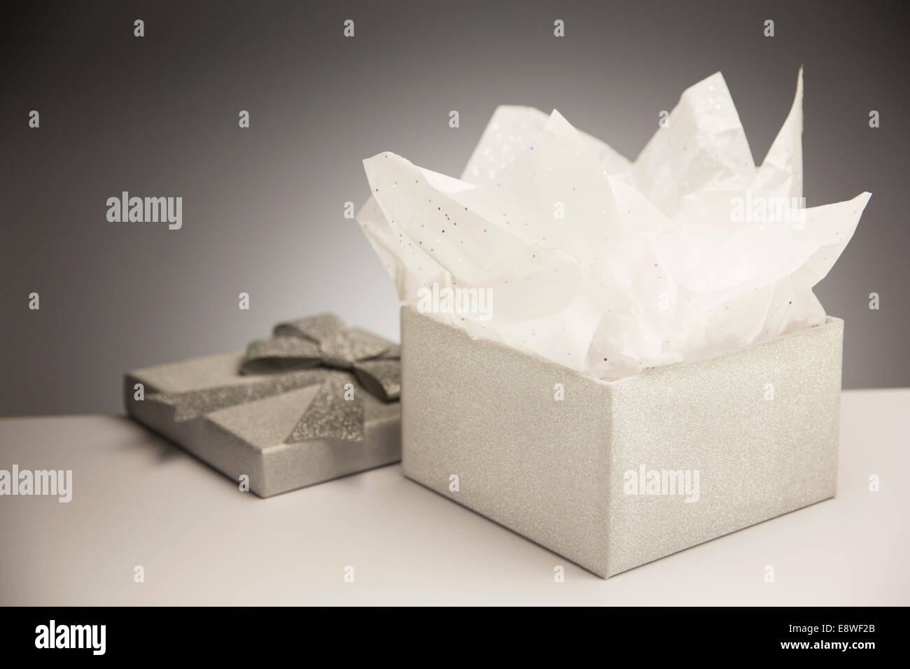 Close up of opened gift with tissue paper Stock Photo