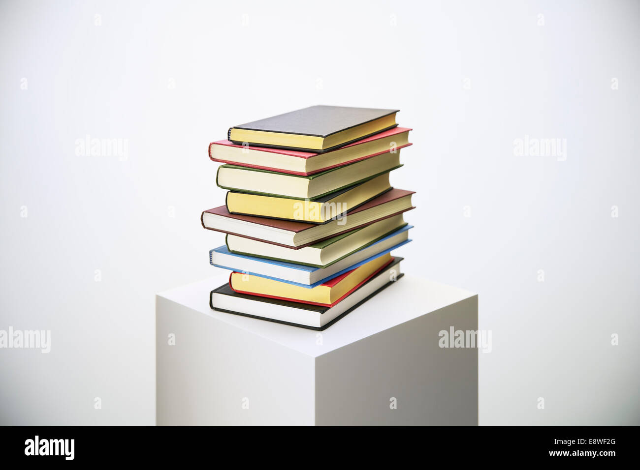Stack of books on pedestal Stock Photo