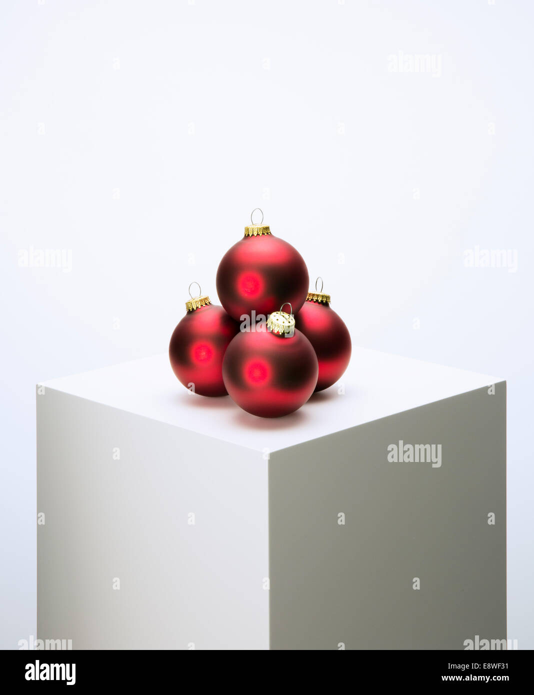 Pile of Christmas ornaments on pedestal Stock Photo