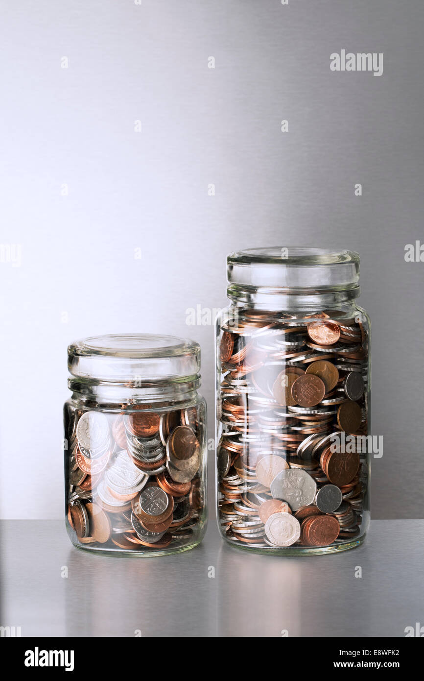 Change jars sitting on counter Stock Photo