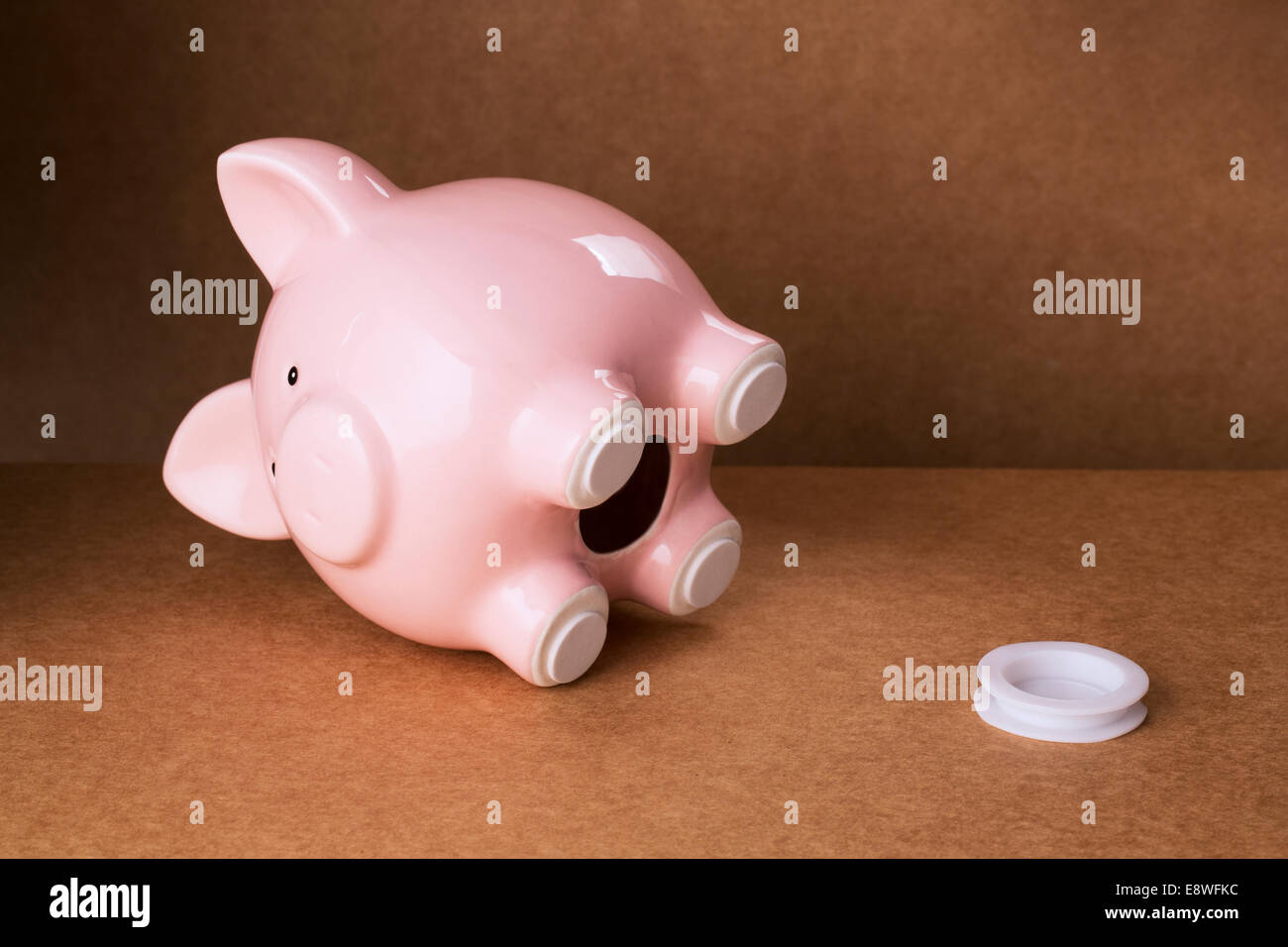 Empty piggy bank with stopper on counter Stock Photo