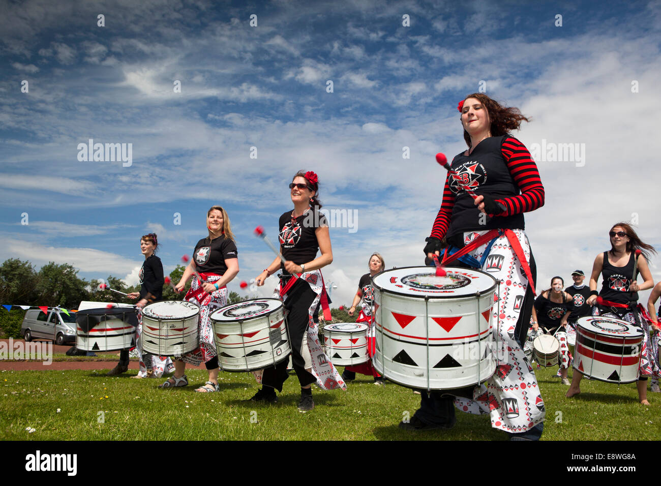UK, England, Lancashire, Morecambe, Batala Brazilian drumming troupe entertaining visitors on prom Stock Photo