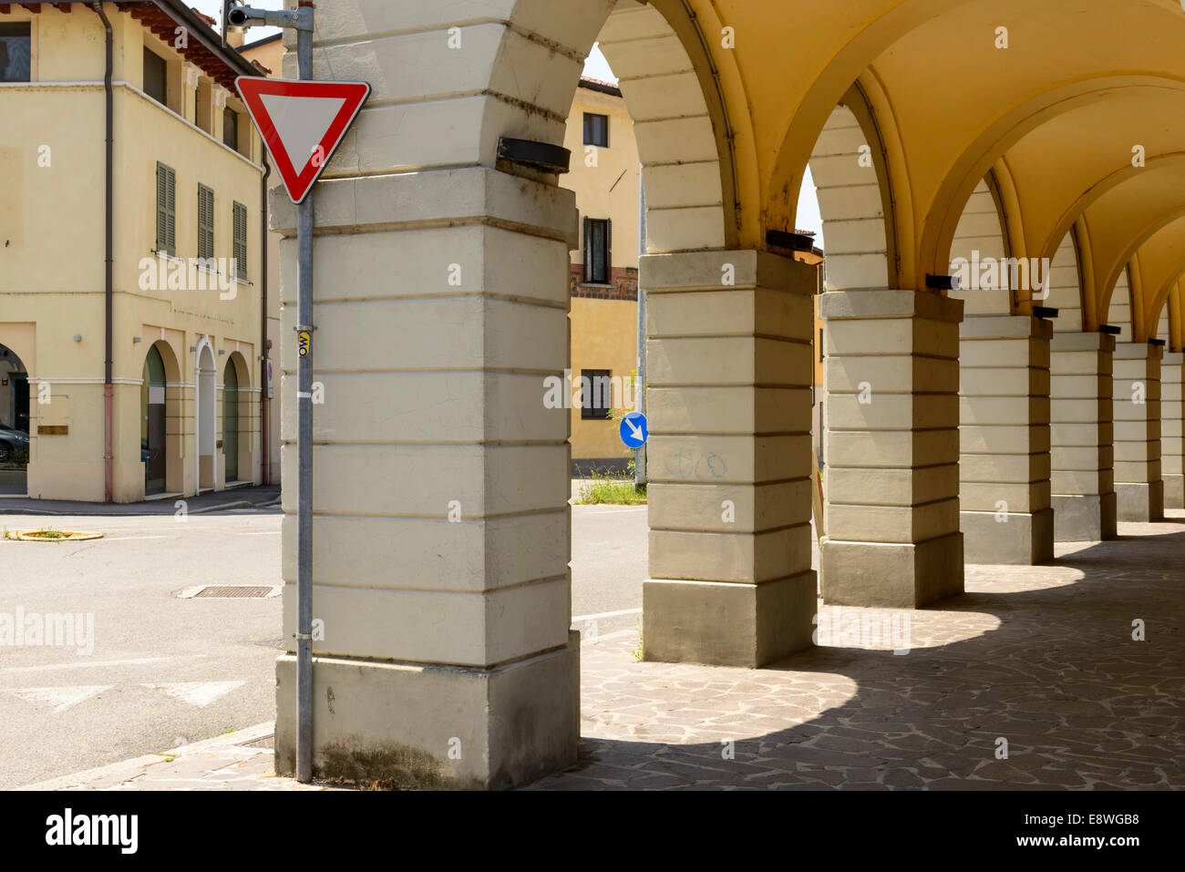 Soncino, foreshortening of old arcades and their shade in city center, shot in bright summer light Stock Photo