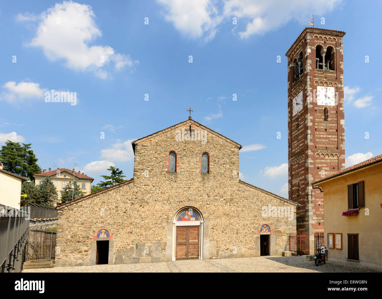 view from west of the ancient Romanesque church and its bell-tower in Brianza region, near Milan, shot in bright summer light Stock Photo