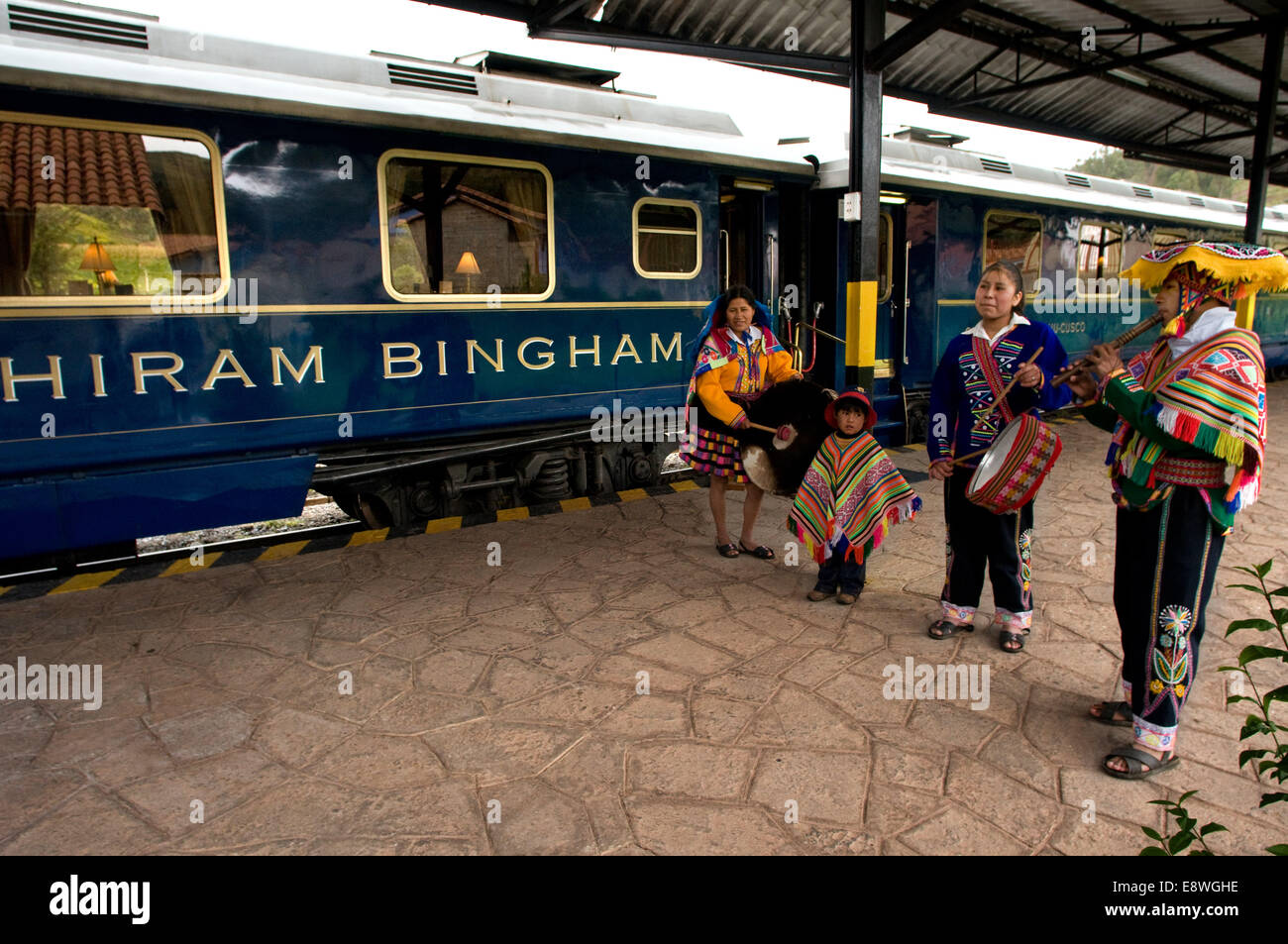 Peru Luxury train from Cuzco to Machu Picchu. Orient Express. Belmond. Musicians and dancers in traditional costumes brighten up Stock Photo