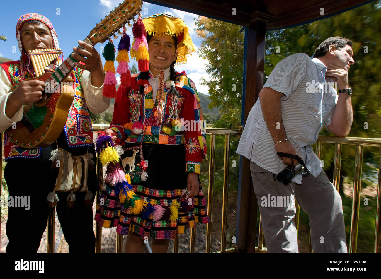 Andean Explorer, luxury train from Cusco to Puno. Train inside. Musicians and dancers in traditional costumes ride on beautify t Stock Photo