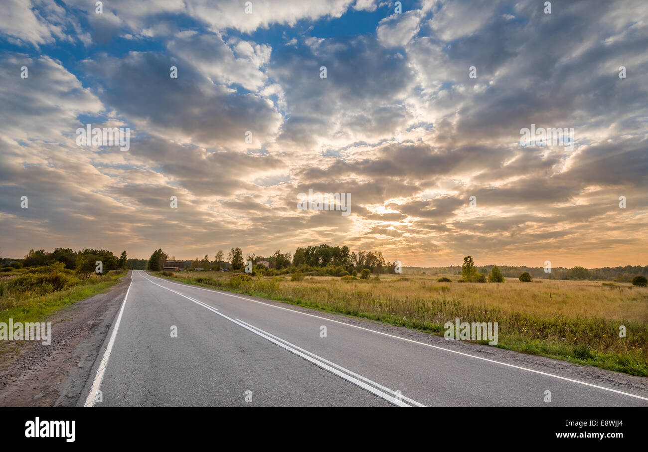Sunrise at the road Stock Photo - Alamy
