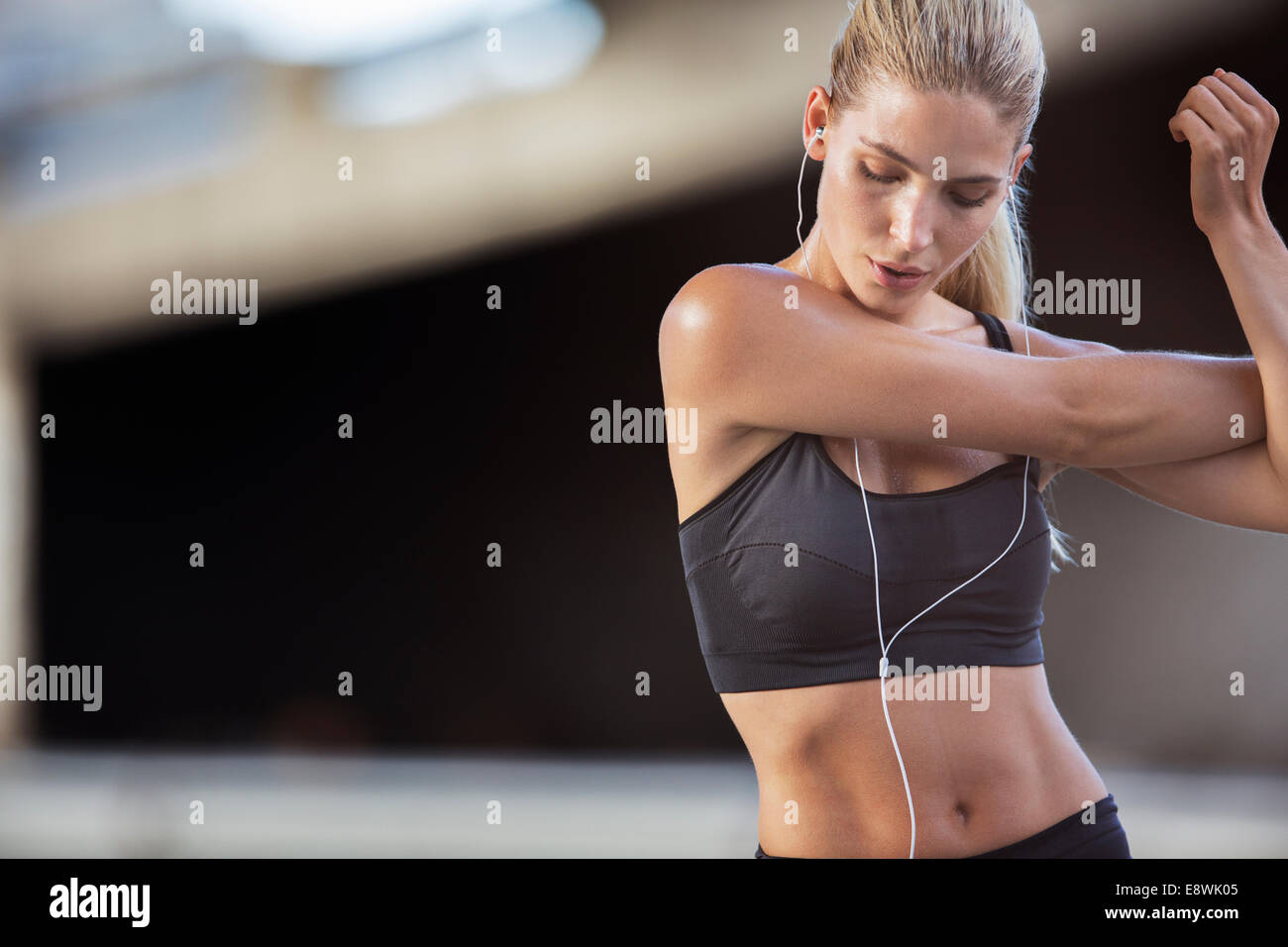 Woman stretching arms before exercise Stock Photo