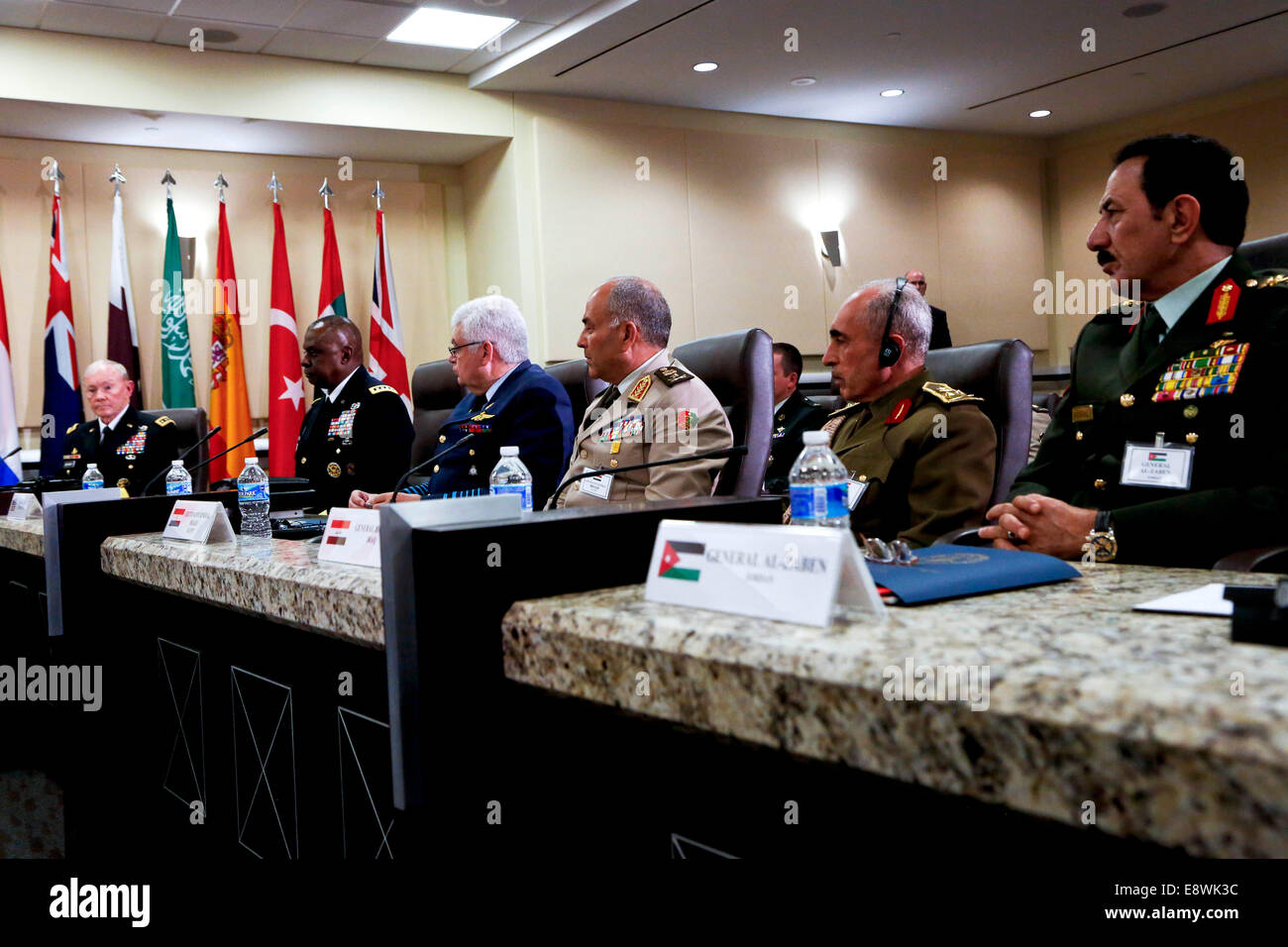 United States President Barack Obama (unseen) speaks after attending a meeting hosted by Joint Chiefs of Staff General Martin E. Dempsey (L) with the military leadership from 21 coalition partner nations to discuss the coalition efforts in the ongoing campaign against ISIL on October 14, 2014 at Joint Base Andrews in Maryland. Air Marshal Binskin from Australia (3L), General Yousif from Bahrain, General Gerard Van Caelenberge from Belgium, General Lawson from Canada (2L), Lieutenant General Ludvigsen from Denmark, Lieutenant General Hegazy from Egypt (3R), General de Villiers from France (L), Stock Photo