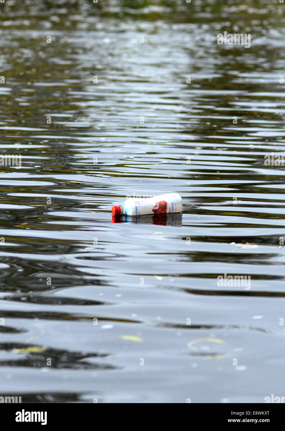 Plastic bottle floating in the river Tees in County Durham Stock Photo