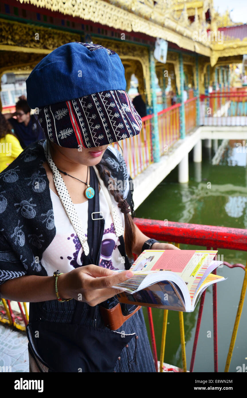 Woman Reading A Guide Thai woman reading guide book at Botahtaung Pagoda in yangon Myanmar ...