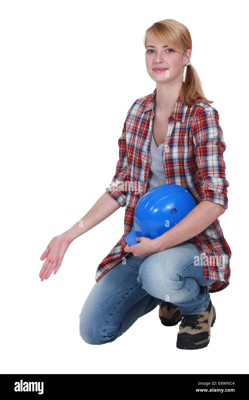 Female Artisan Kneeling And Gesturing Stock Photo Alamy