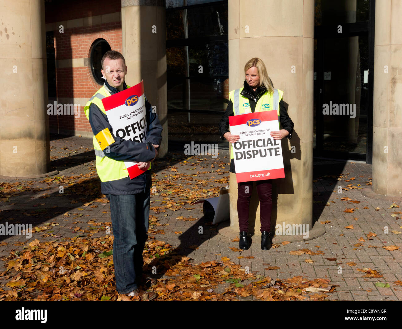 Middlesbrough, UK. 15th October, 2015. Man woman PCS Union Strike picketsPublic Commercial Services Union members picketing picket Teesside  Combined Law Court Services building in Middlesbrough nationwide strike pay rise claim to be paid a Public Sector Pay Review Body Middlesbrough Cleveland England UK British. Credit:  Peter Jordan NE/Alamy Live News Stock Photo