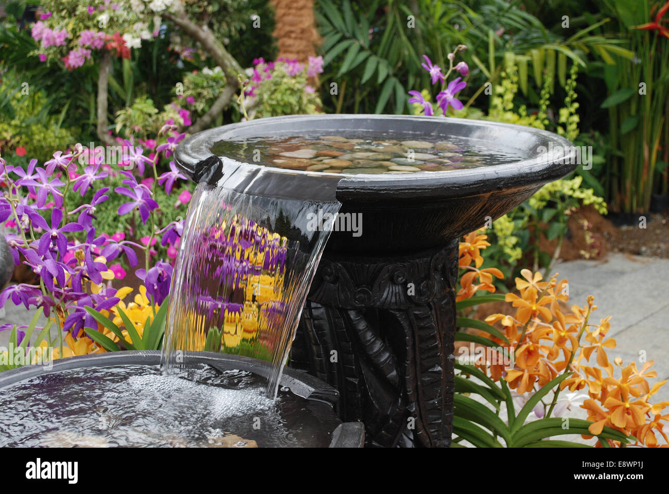 Water fountain in garden landscape Stock Photo Alamy