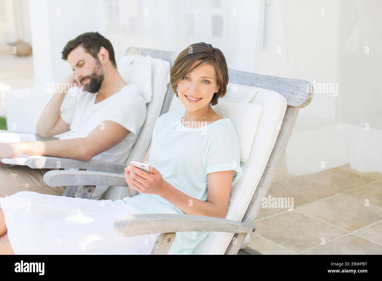 Woman relaxing in lawn chair hi-res stock photography and images - Alamy