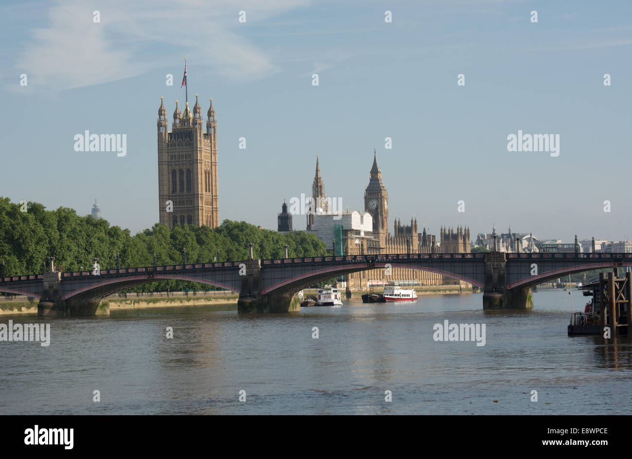 A view towards Southwark bridge with the Houses of Parliament beyond Stock Photo