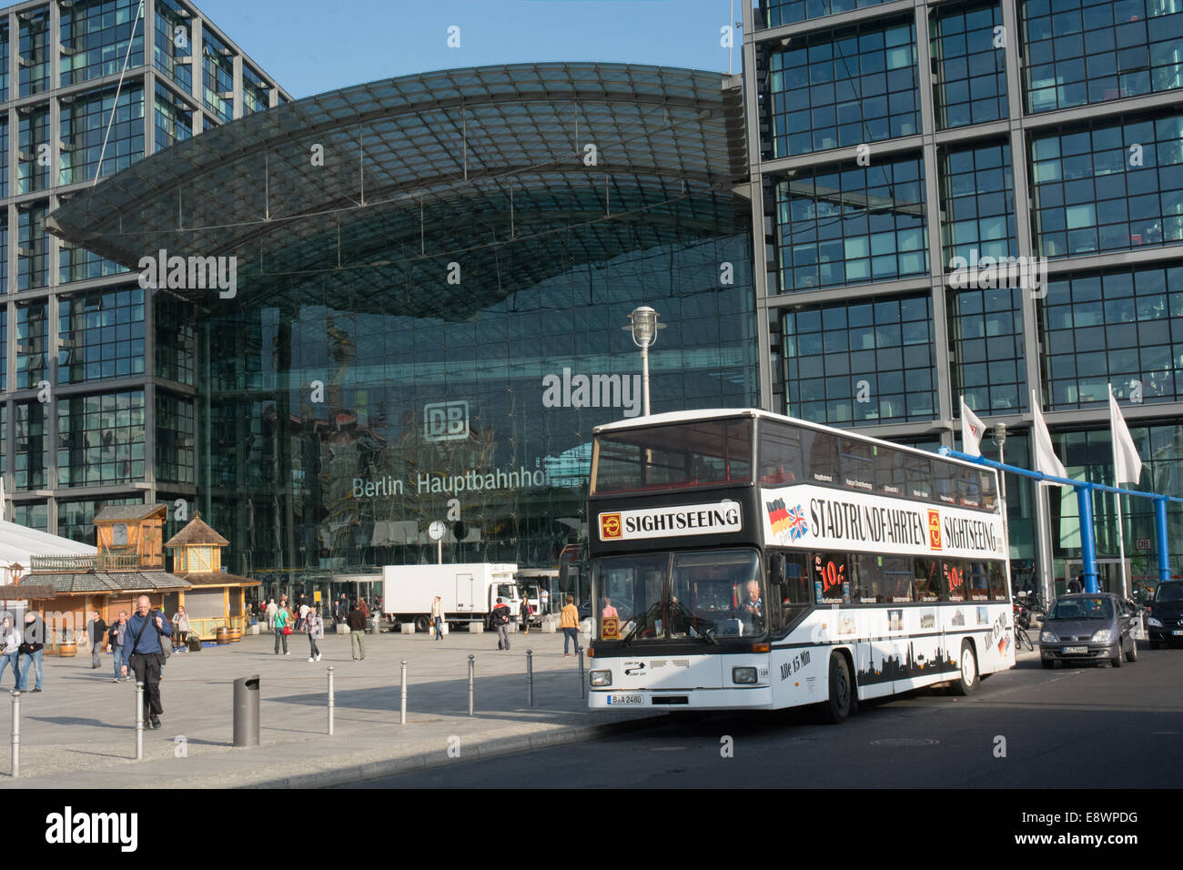A sightseeing bus waits outside Berlins main railway station the Hauptbahnhof Stock Photo
