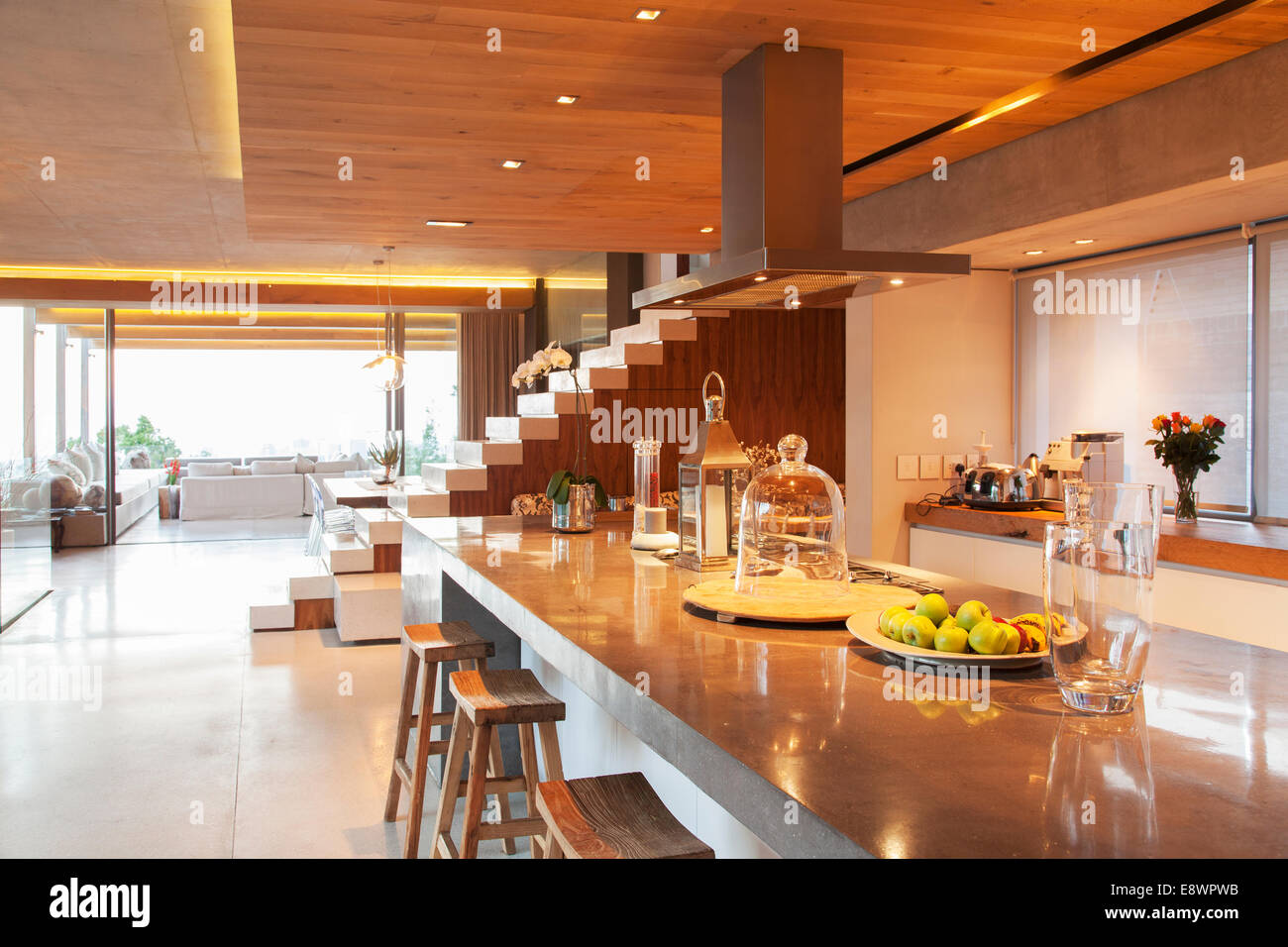 Counter, steps and sofa in open modern house Stock Photo