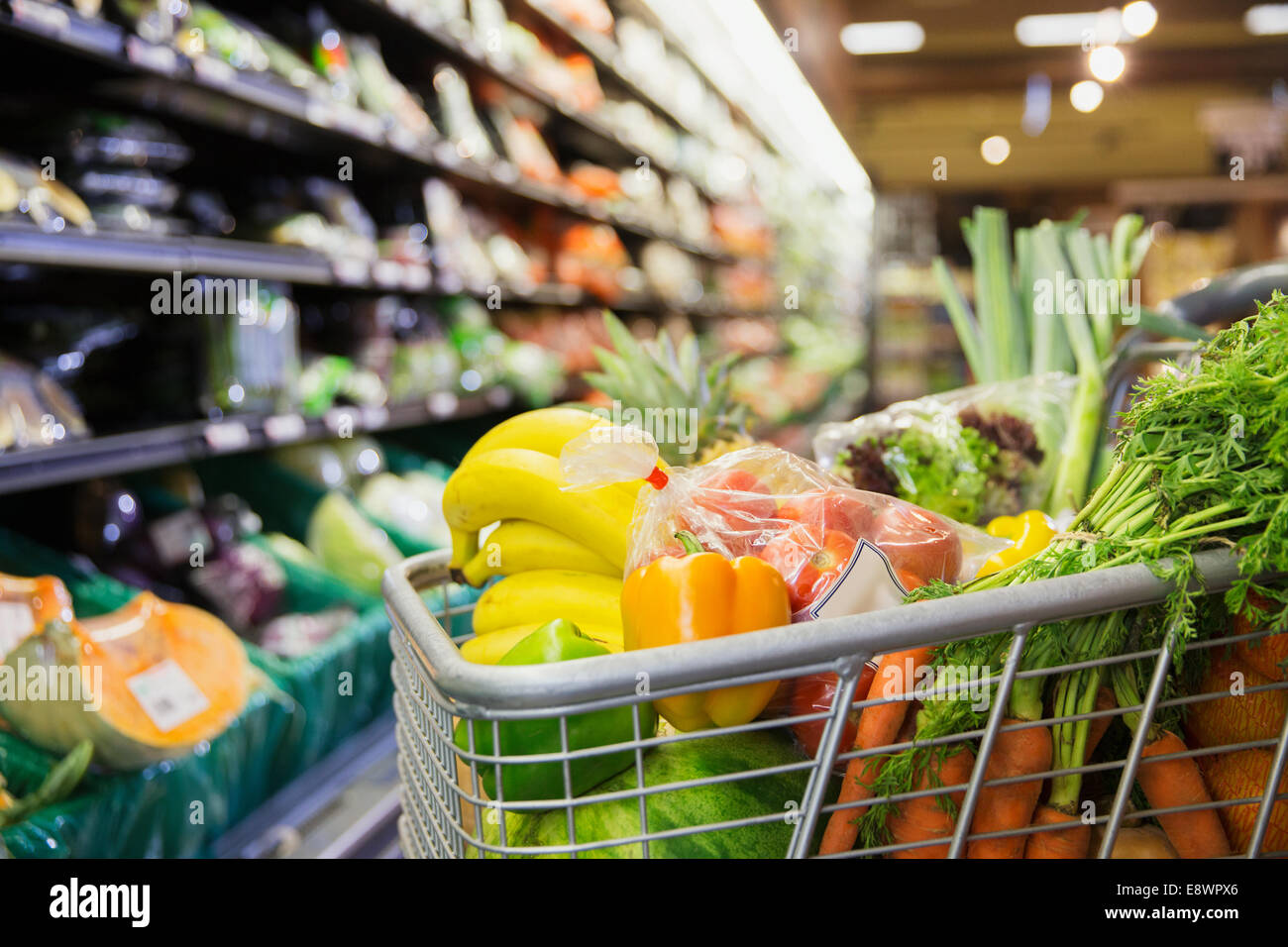 Close up of full shopping cart in grocery store Stock Photo