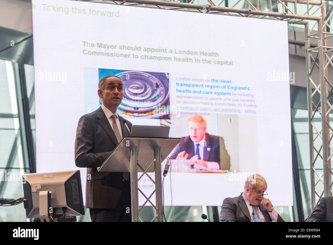 London, UK. 15th October, 2014.  Pioneering surgeon and former health minister, Lord Ara Darzi, presents the final report of the London Health Commission to the Mayor of London Boris Johnson at City Hall. The report, Better Health for London, proposes tough measures to combat the threats posed by tobacco, alcohol, obesity, lack of exercise and pollution, which harm millions of people. Together the proposals amount to the biggest public health drive in the world. It contains over 60 recommendations and sets out 10 ambitions for the city with targets. Credit:  Stephen Chung/Alamy Live News Stock Photo