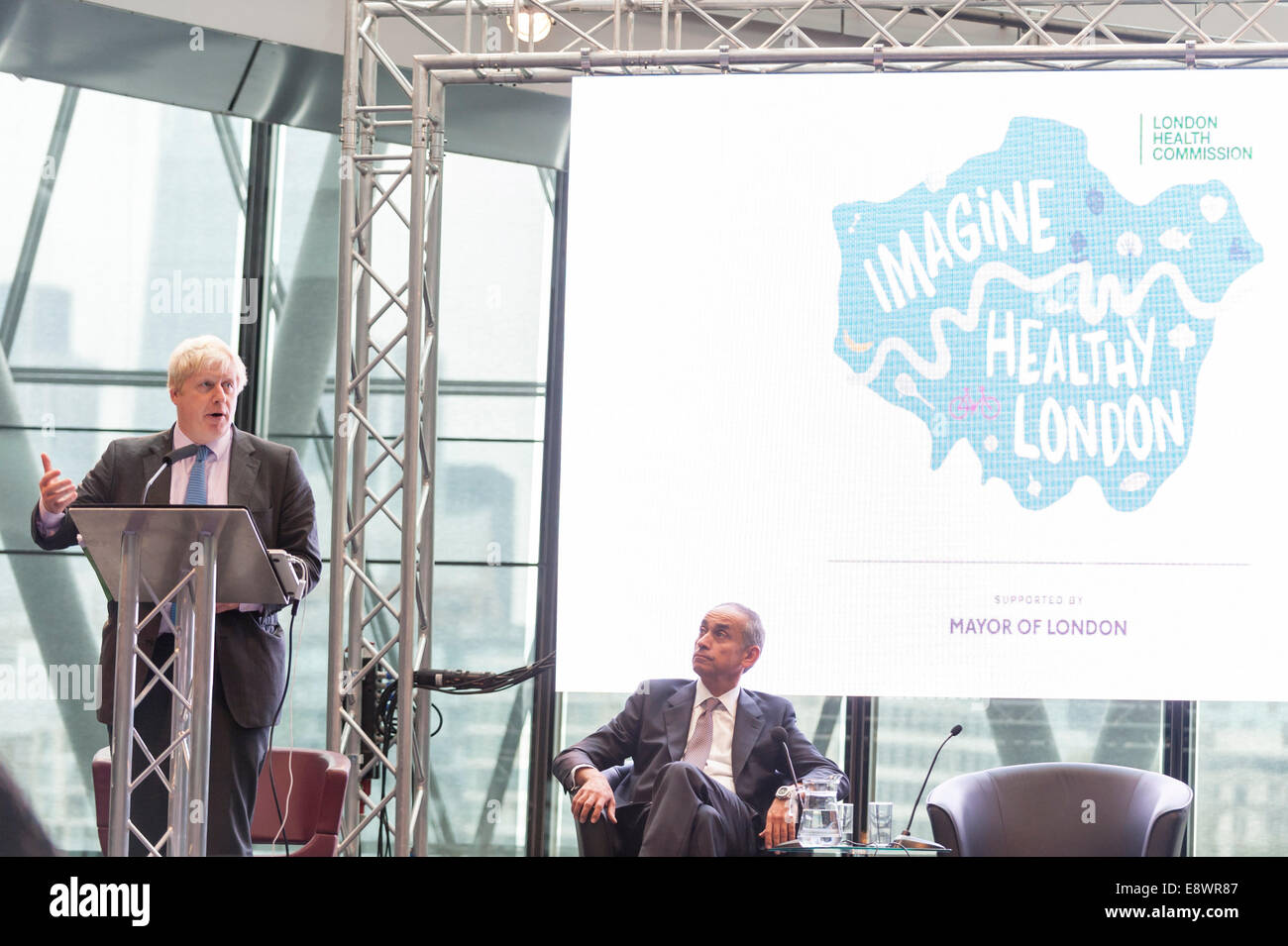 London, UK. 15th October, 2014.  Pioneering surgeon and former health minister, Lord Ara Darzi, presents the final report of the London Health Commission to the Mayor of London Boris Johnson at City Hall. The report, Better Health for London, proposes tough measures to combat the threats posed by tobacco, alcohol, obesity, lack of exercise and pollution, which harm millions of people. Together the proposals amount to the biggest public health drive in the world. It contains over 60 recommendations and sets out 10 ambitions for the city with targets. Credit:  Stephen Chung/Alamy Live News Stock Photo