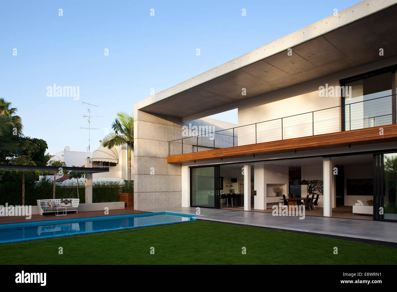Double height balcony facade and swimming pool of D House, Israel