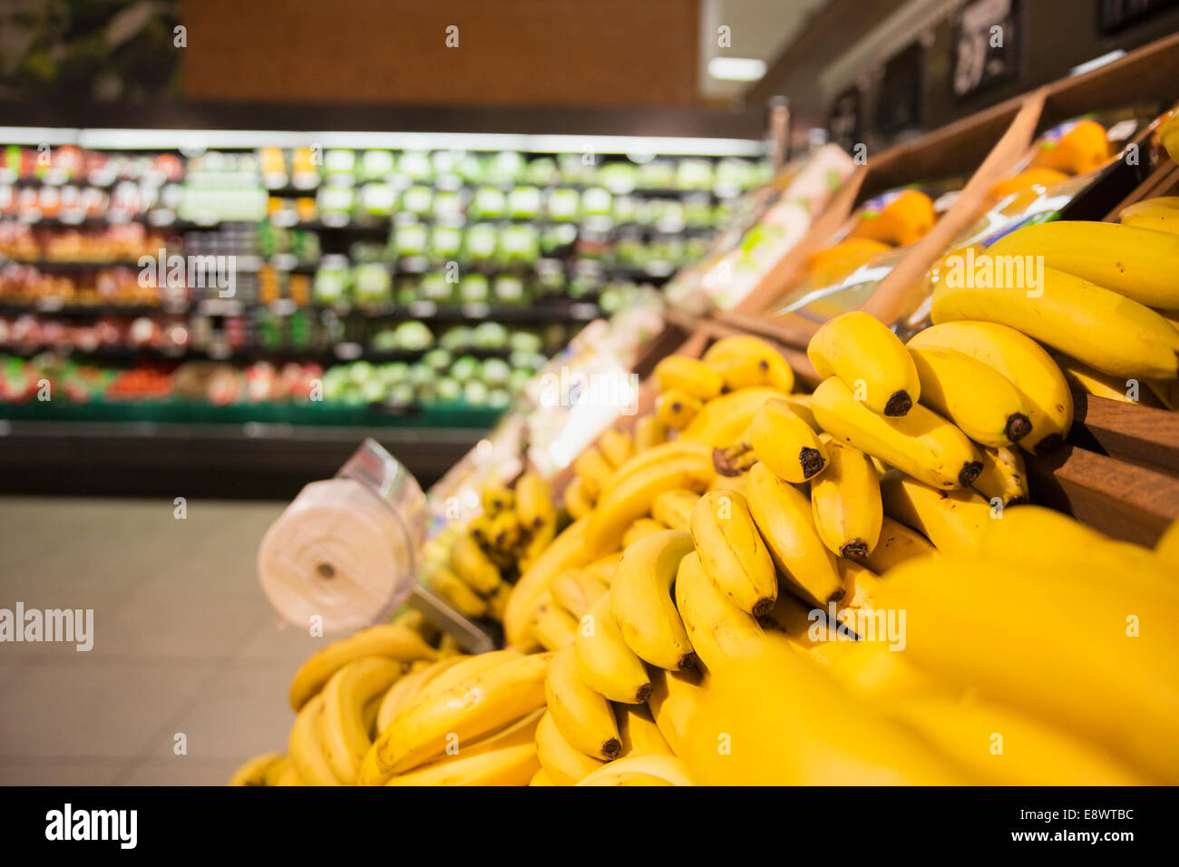 Close up of bananas in produce section of grocery store Stock Photo Alamy